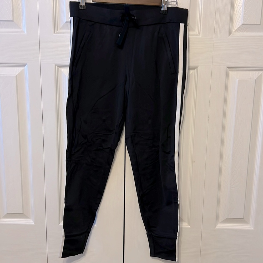 Athleta, size small black joggers with double white stripes down sides